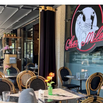 Chez Milen terrace and sign